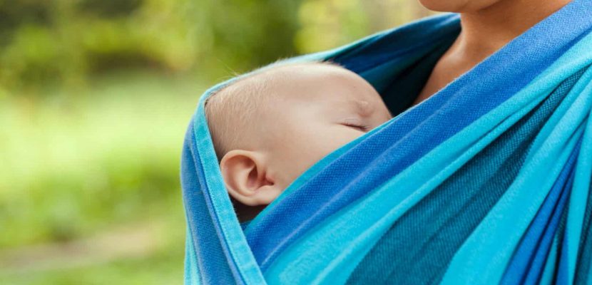 Baby is sleeping in sling, close up face